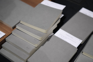 personalised grey notebooks with silver embossing as door gifts at lamitak portfolio volume two launch party 2019 at lamitak studio